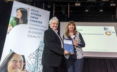 Carol Scott receiving the award by Sir Paul Nurse, Director of the Francis Crick Institute and a Patron of Athena Swan. 