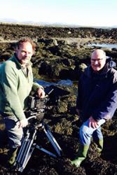 Cameraman Richard Kirby filming in Trearddur Bay with advice from Professor Chris Richardson of the School of Ocean Sciences.