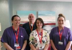 Student nurses Jennifer Griffiths, (left) and Charlotte Brown (right) with Eleri Williams, Deputy Manager and Mark Aldred, Senior Nurse at Merton Place in Colwyn Bay.