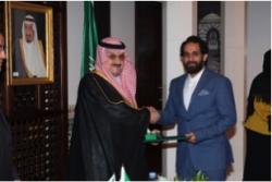 Othman receiving his award from the Saudi Ambassador to the UK