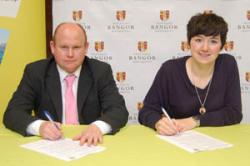 Richard Bennett (left) and Jo Caulfield sign the Charter